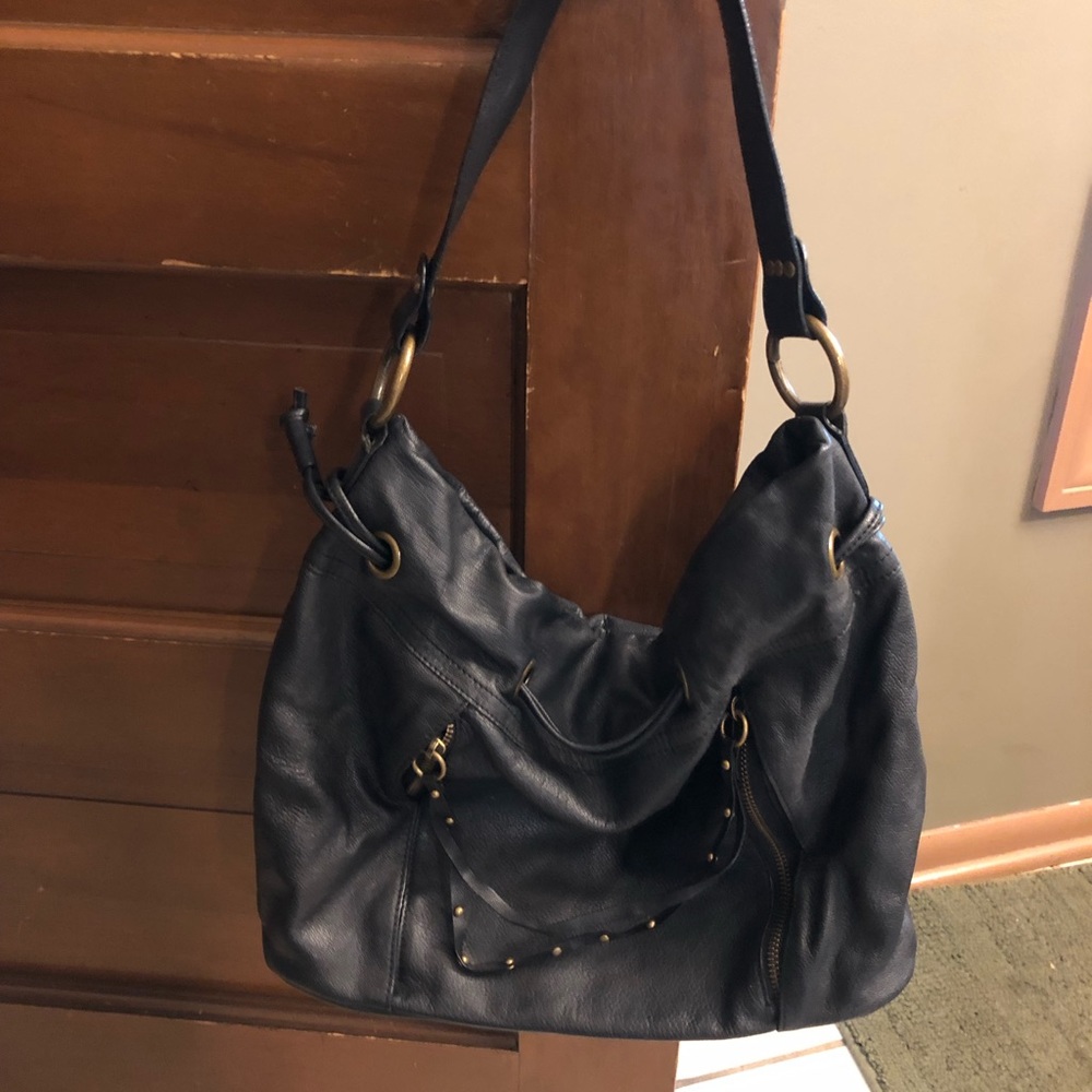 Black leather purse with front zipper pocket
